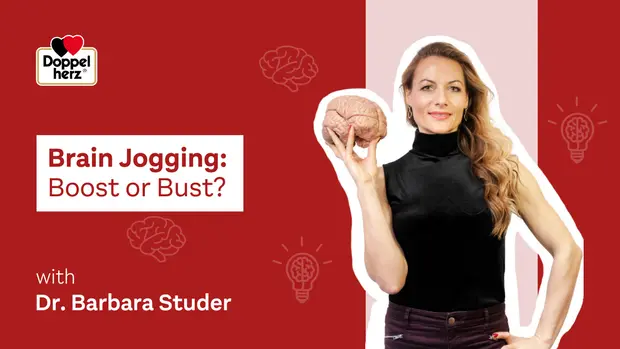 Image présentant une femme prenant la pose avec un cerveau en main. Le texte indique "Brain Jogging: Boost or Bust?" et mentionne Dr. Barbara Studer. Un fond rouge est présent avec des icônes de lumière et de cerveau.